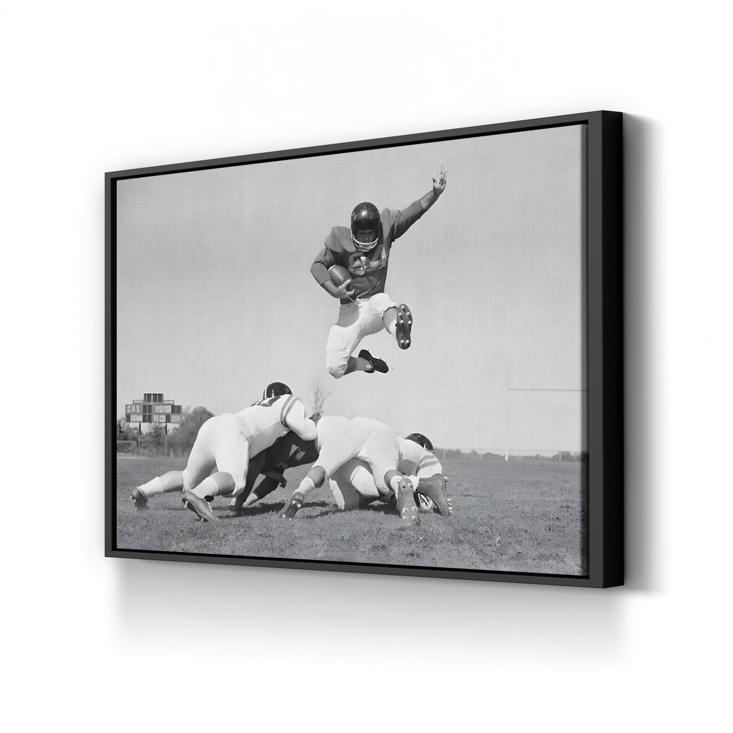 1960s Football Action Leap – Vintage Photography Wall Art | Black & White Sports Canvas Print