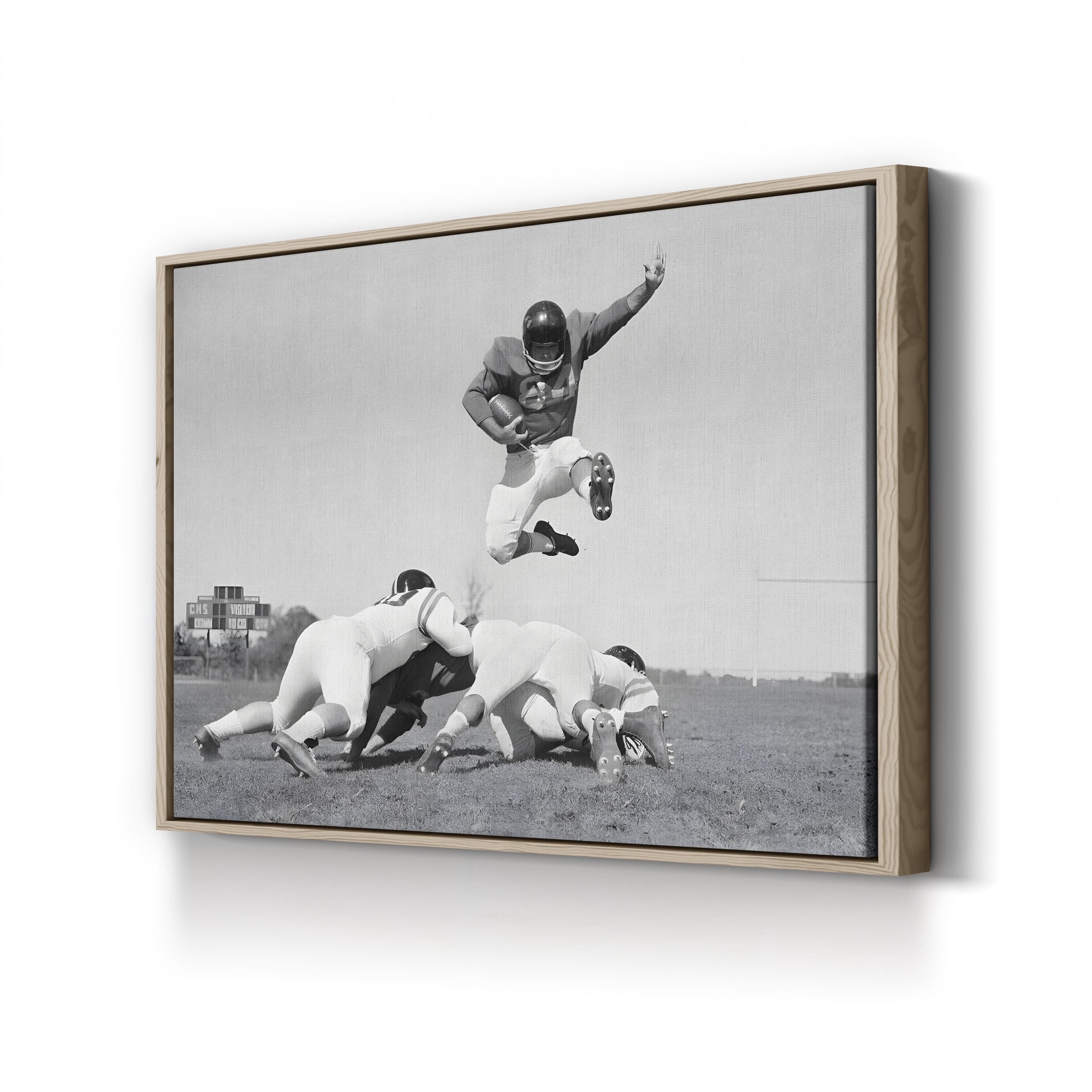 1960s Football Action Leap – Vintage Photography Wall Art | Black & White Sports Canvas Print