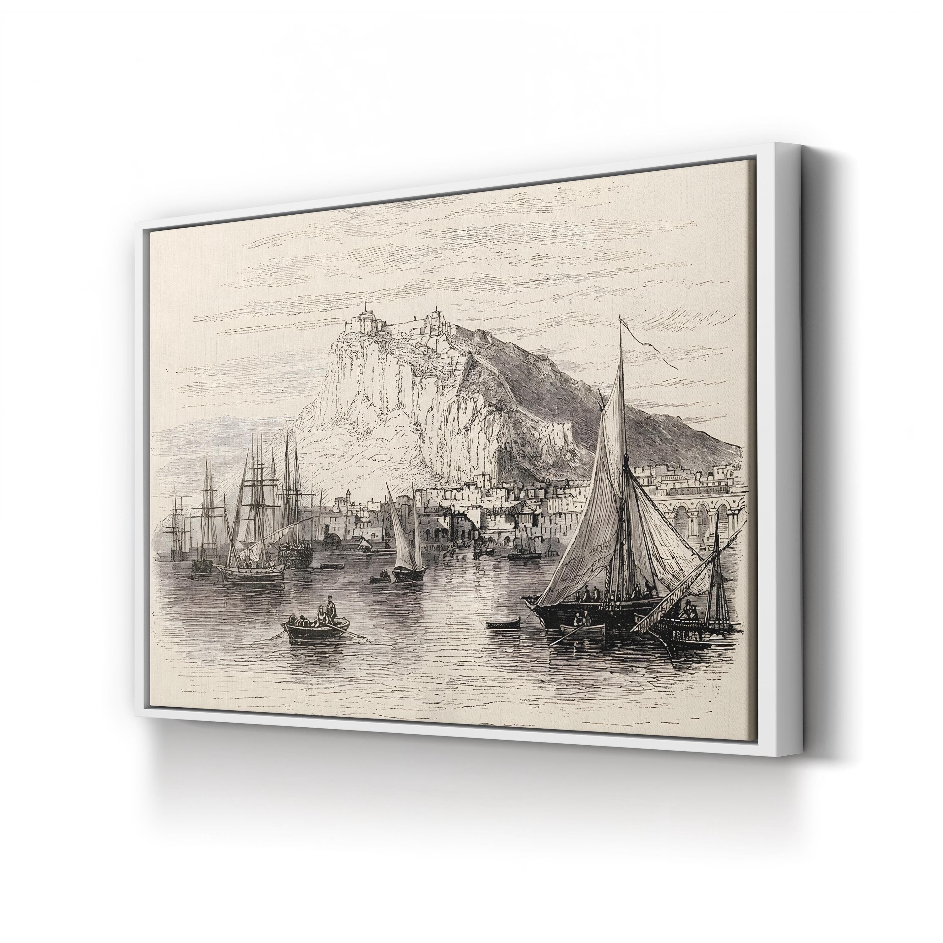 Framed artwork of a coastal scene with boats and a mountainous background.