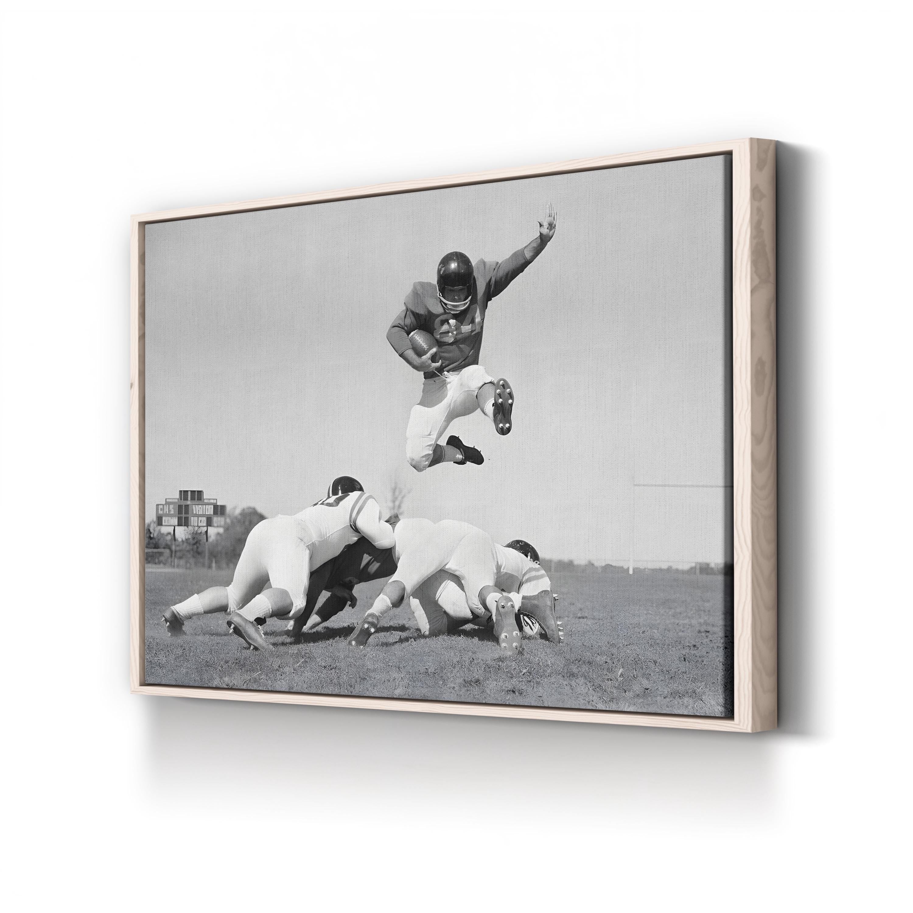 1960s Football Action Leap – Vintage Photography Wall Art | Black & White Sports Canvas Print