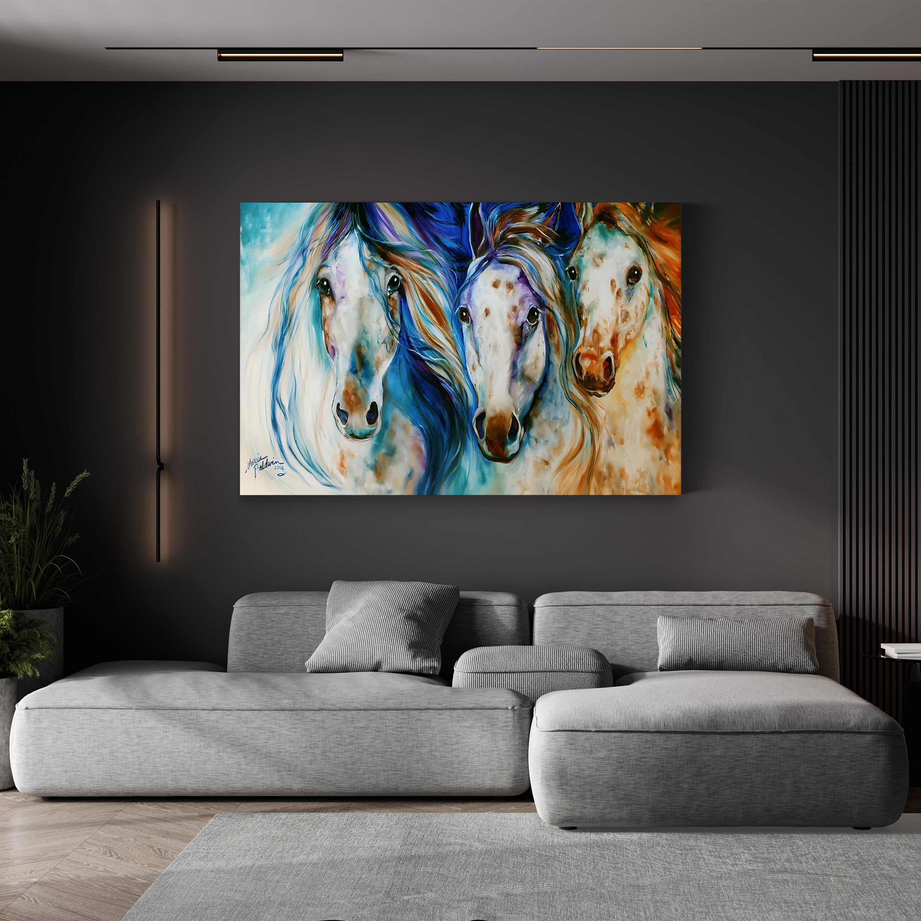 Gray sectional sofa in a living room with a colorful painting of three horses on the wall.
