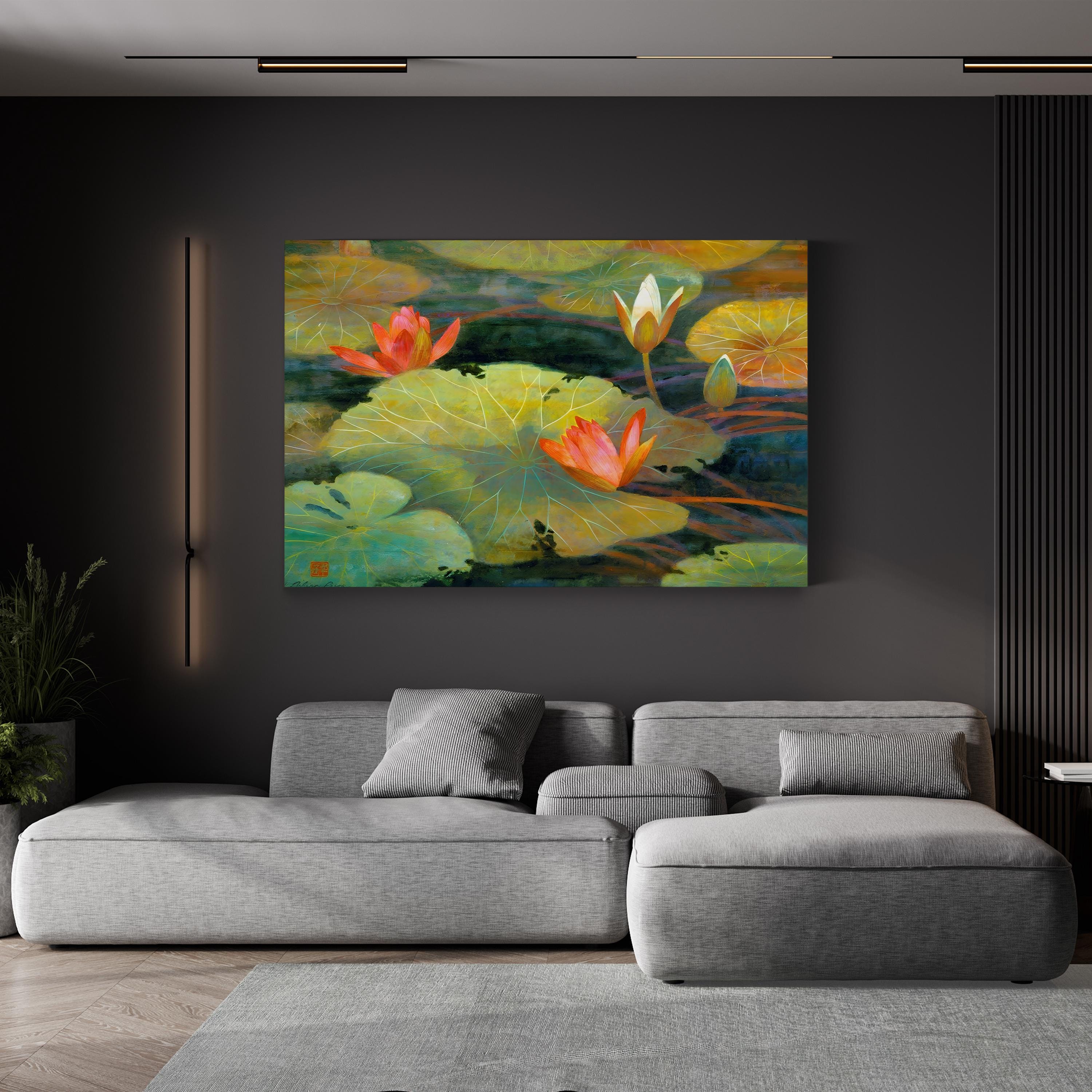 Living room with a gray sofa and a painting of water lilies on the wall.