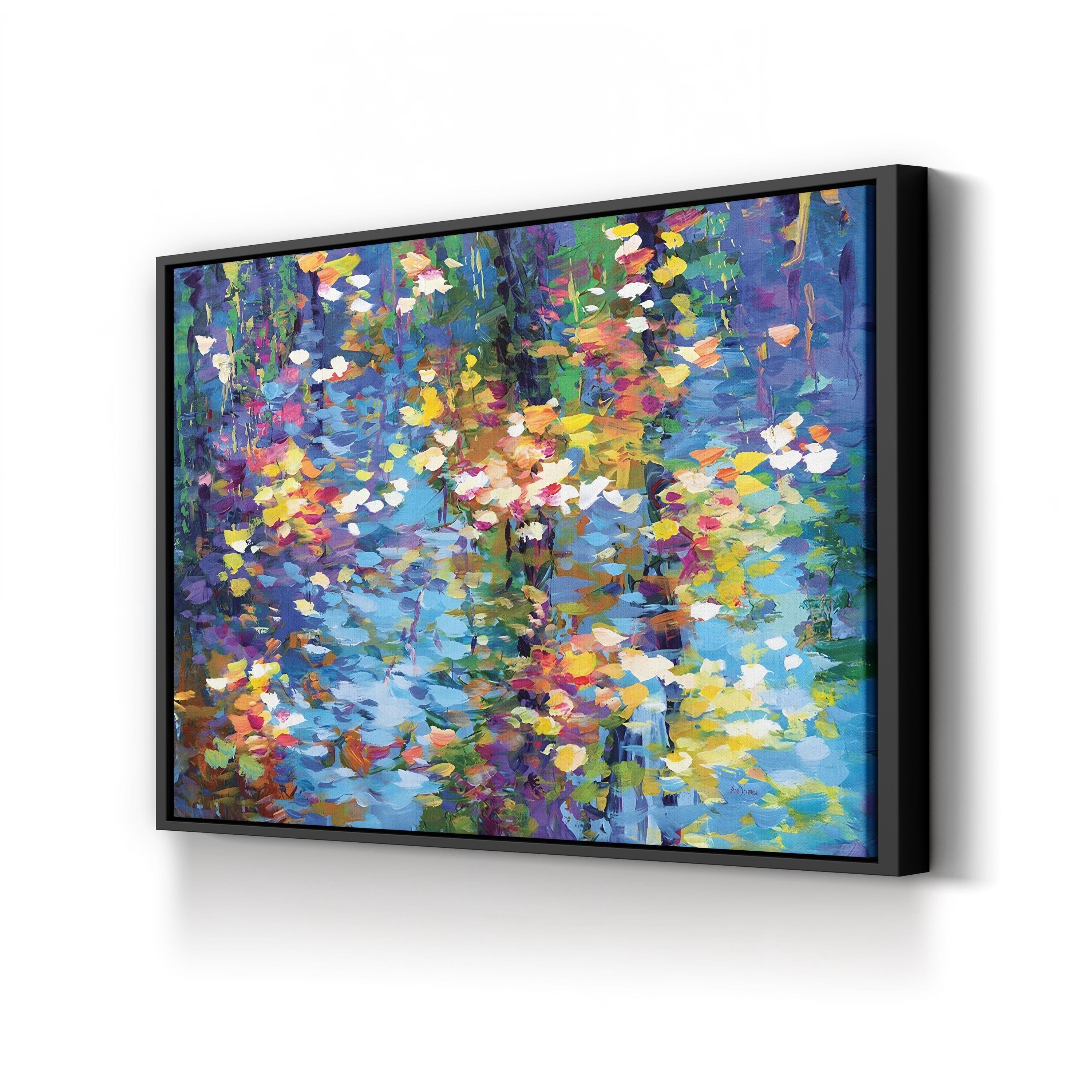 Framed abstract painting with vibrant colors on a white wall