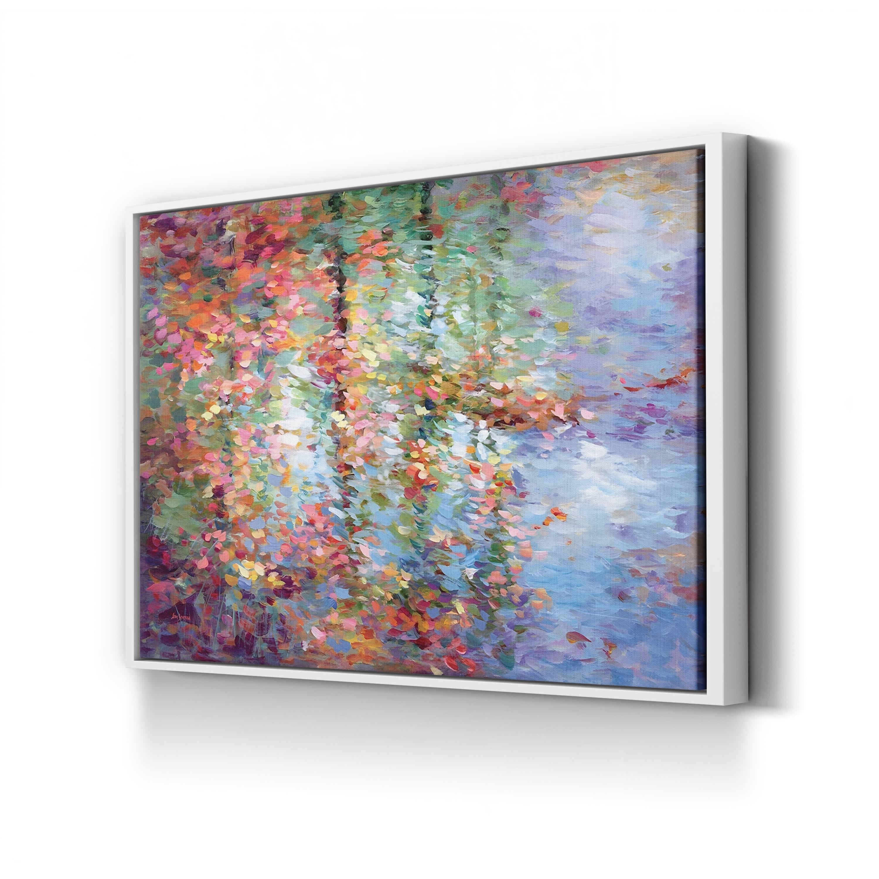 Framed artwork of a colorful abstract painting on a white wall