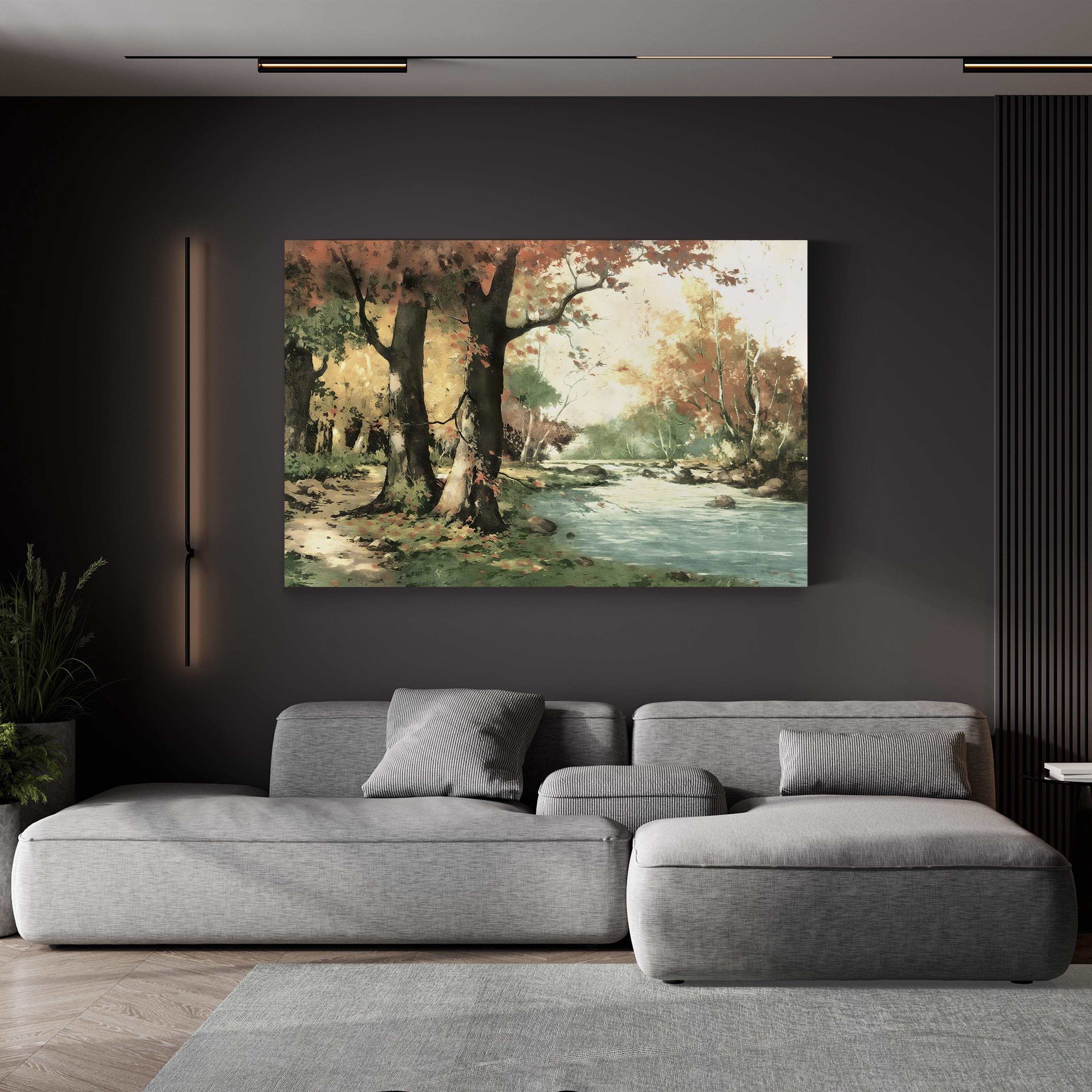Gray sectional sofa in a living room with a nature-themed painting on the wall.
