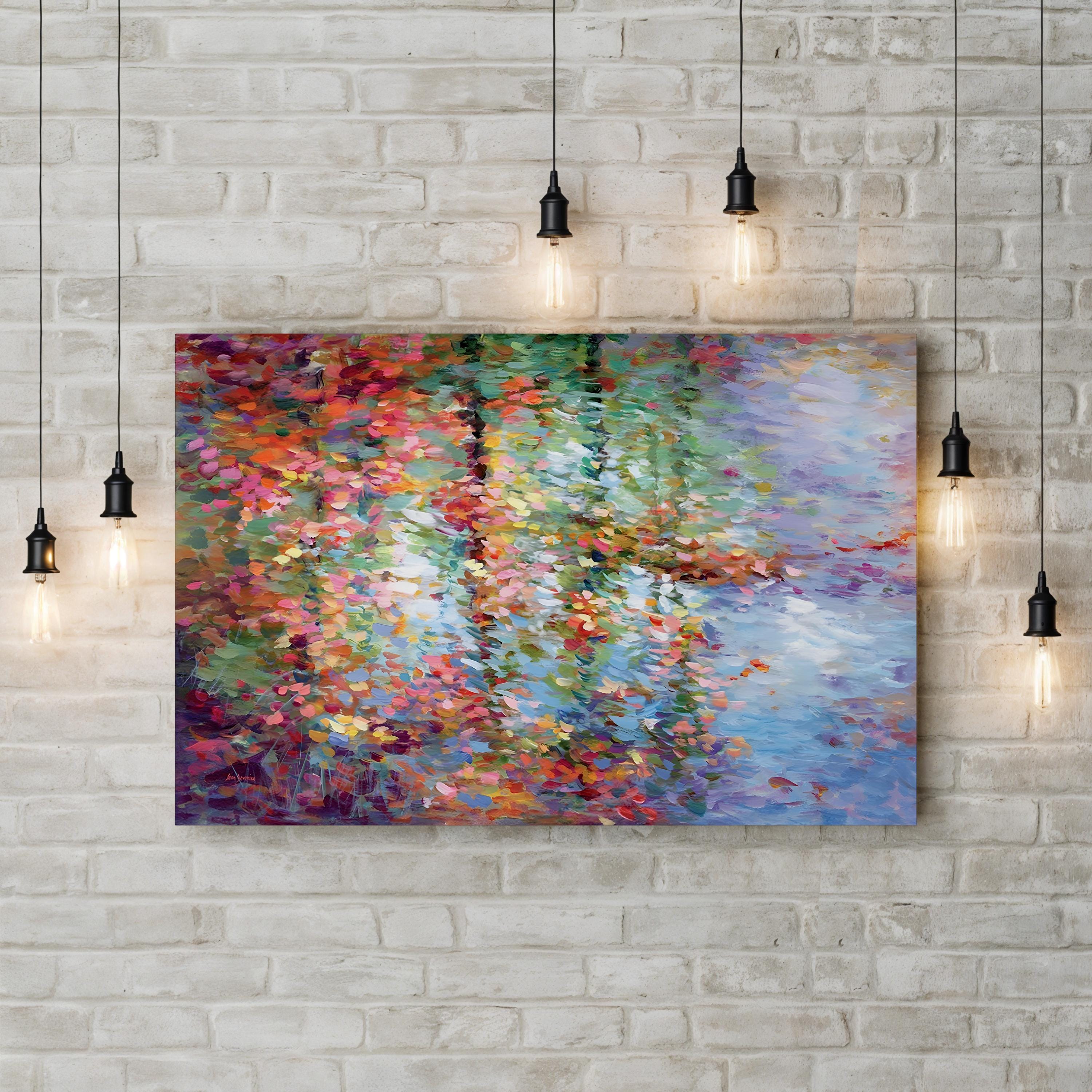 Colorful abstract painting on a brick wall with pendant lights.