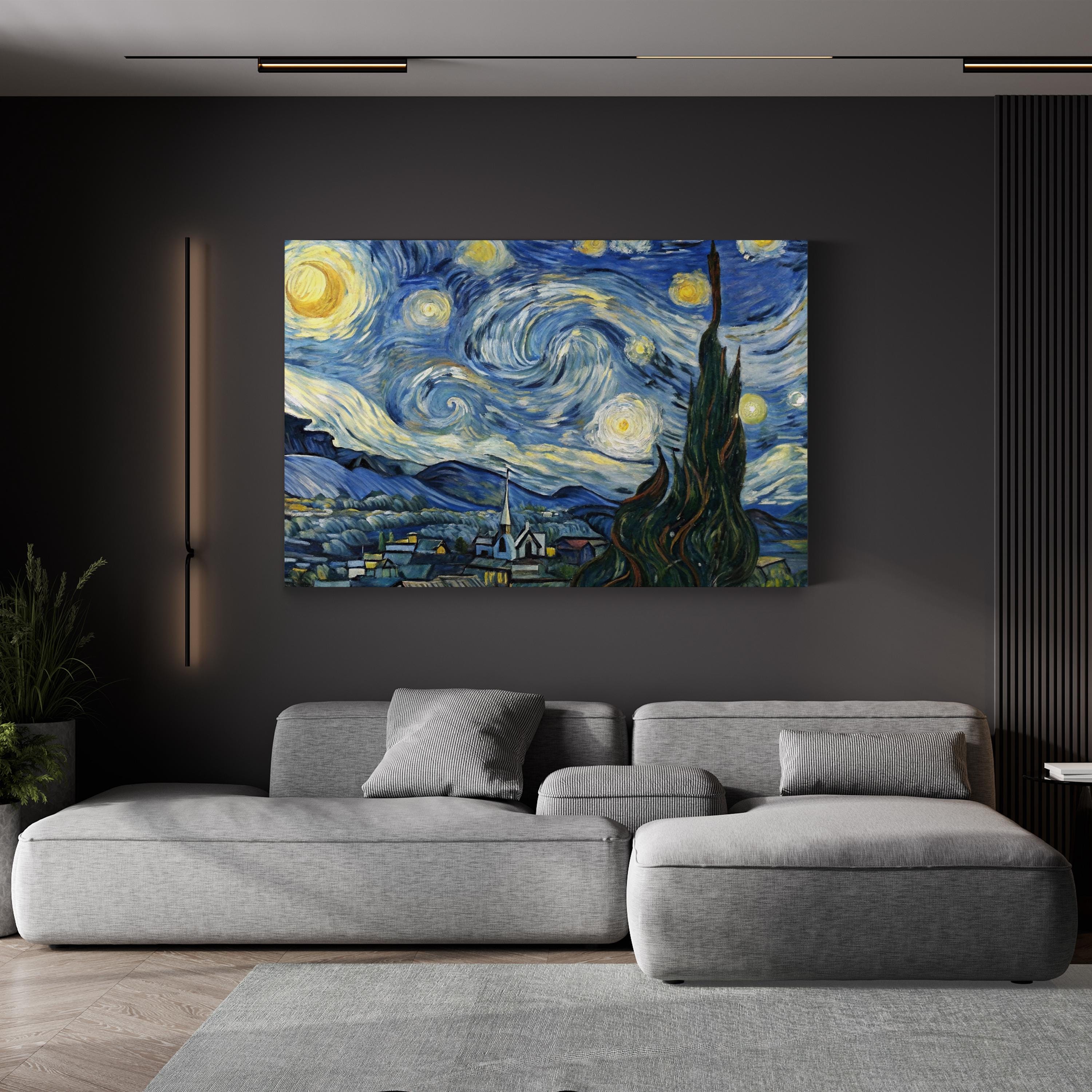 The Starry Night by Vincent van Gogh canvas print displayed above a gray sofa in a modern living room