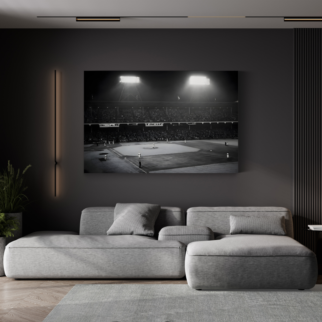 Ebbets Field 1947 Night Game canvas print displayed above a gray sectional sofa in a modern living room