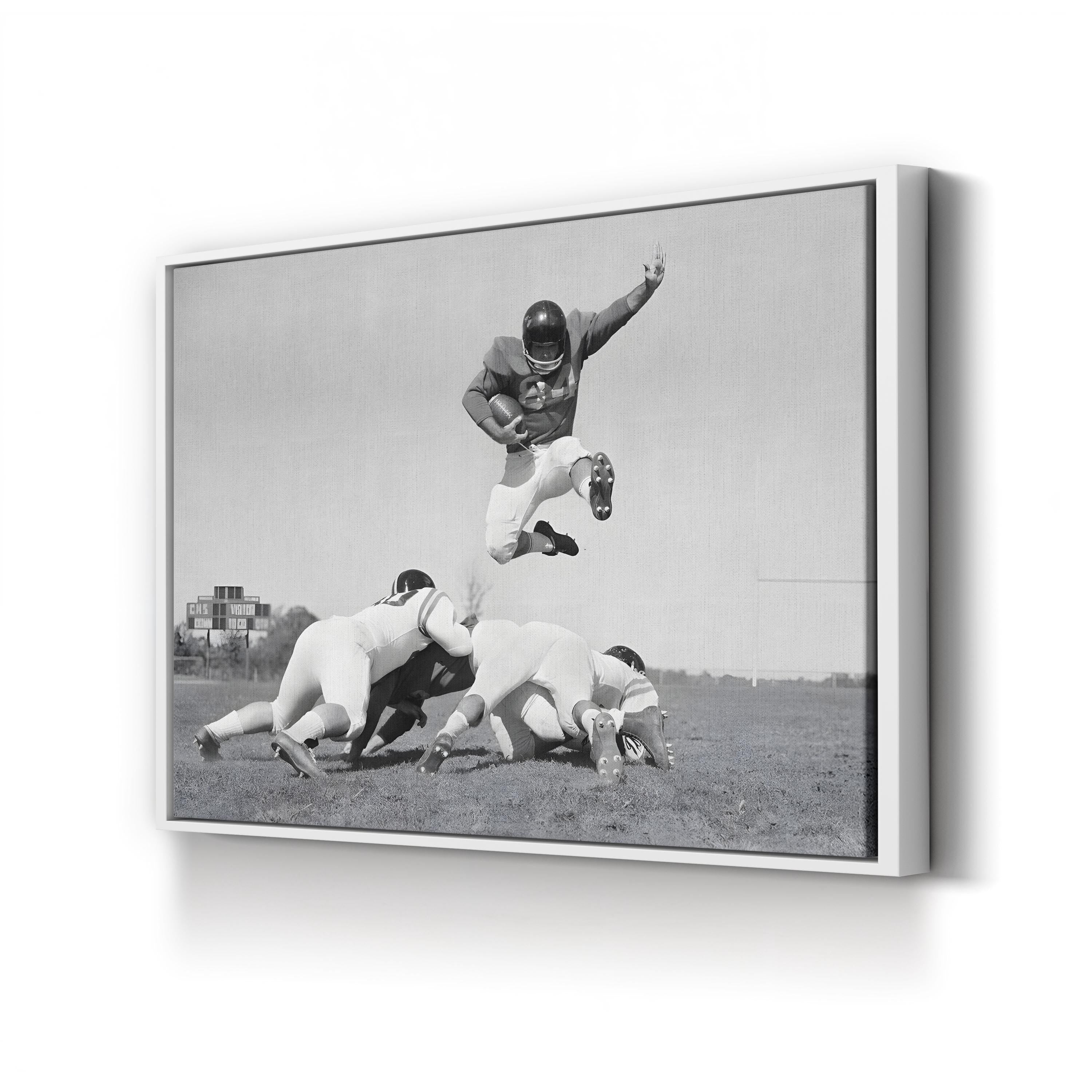 1960s Football Action Leap – Vintage Photography Wall Art | Black & White Sports Canvas Print
