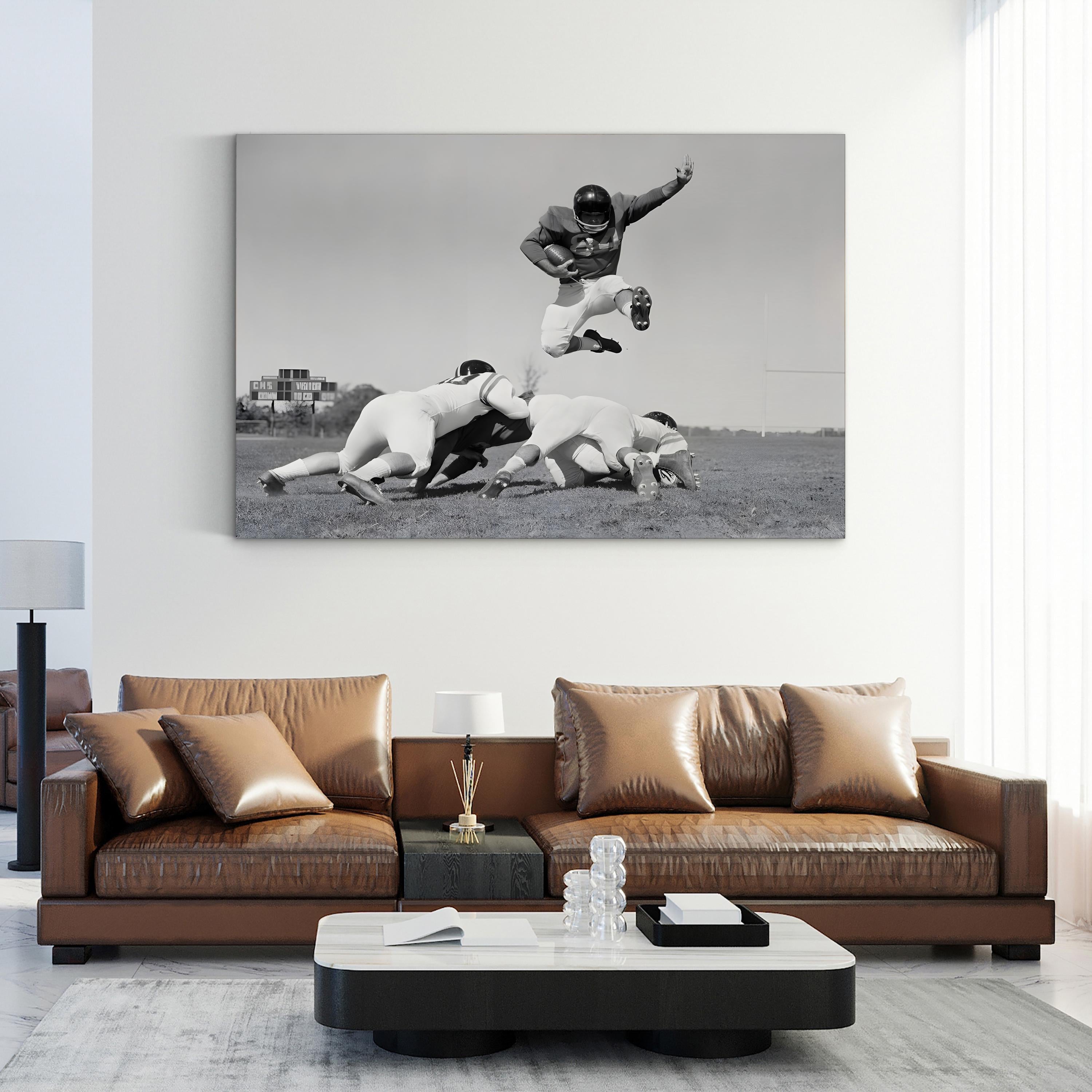 1960s Football Action Leap – Vintage Photography Wall Art | Black & White Sports Canvas Print