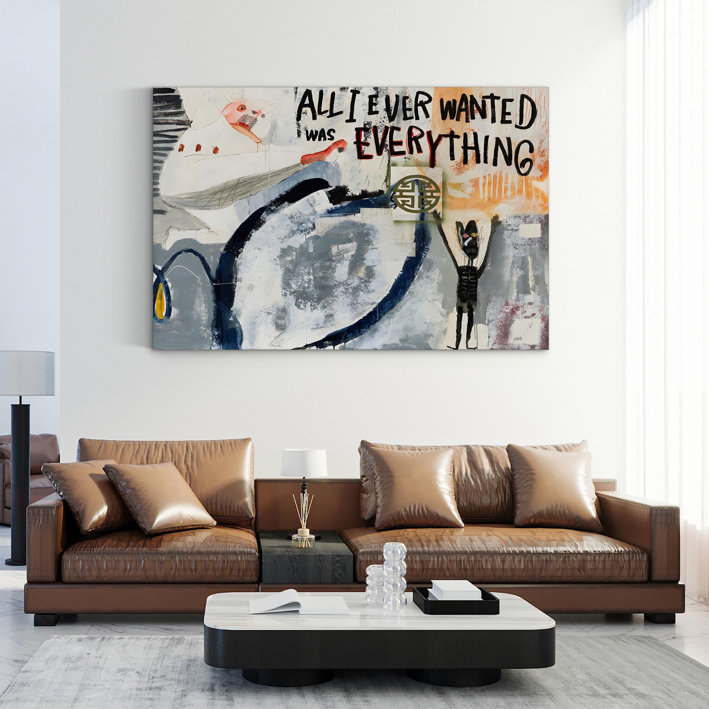 Modern living room with a brown leather sofa and abstract artwork on the wall.