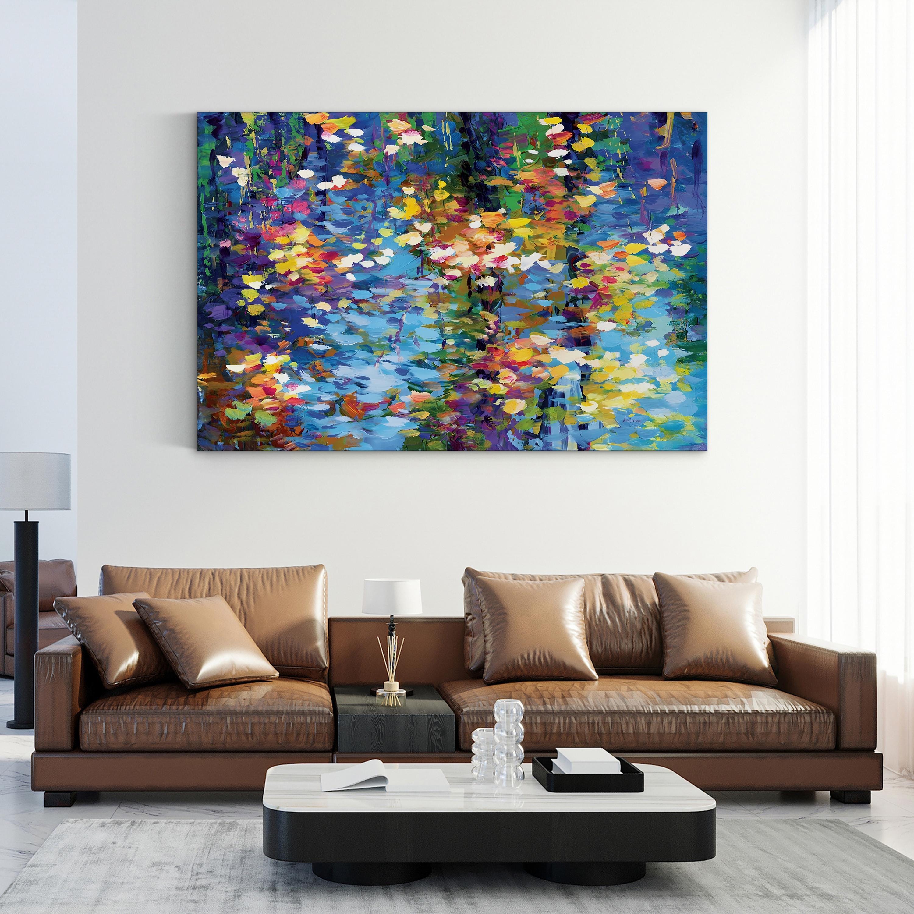 Colorful abstract painting above a brown leather sofa in a living room.