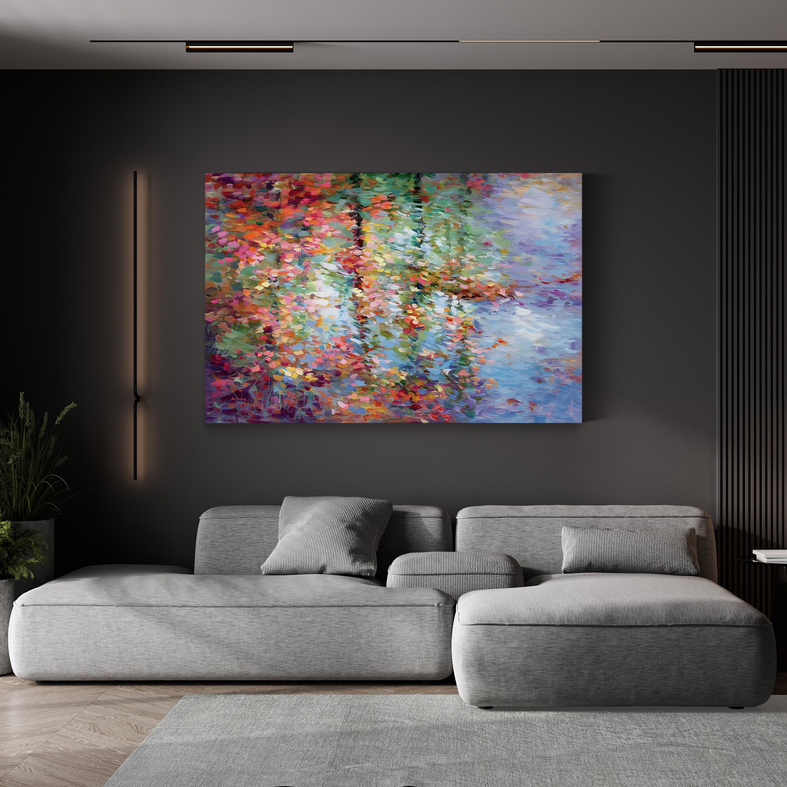 Modern living room with a gray sofa and colorful abstract painting on a dark wall.