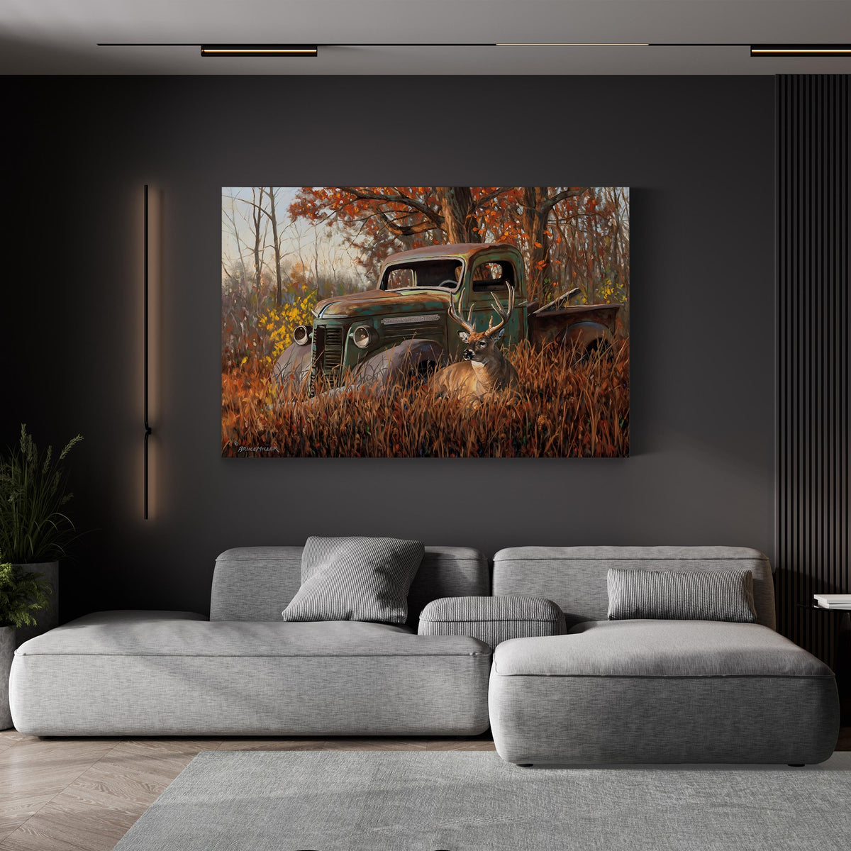 A Buck and a Truck, by Bruce Miller canvas print displayed above a gray sofa