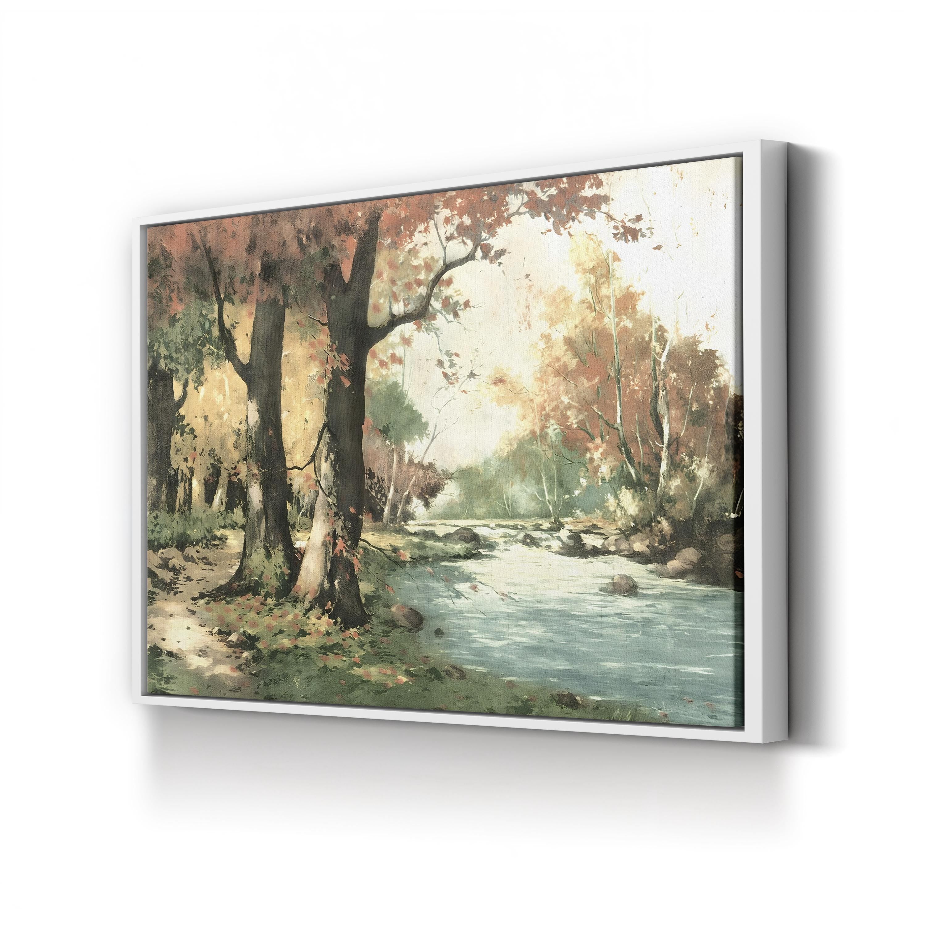 Framed painting of a forest scene with a stream on a white wall