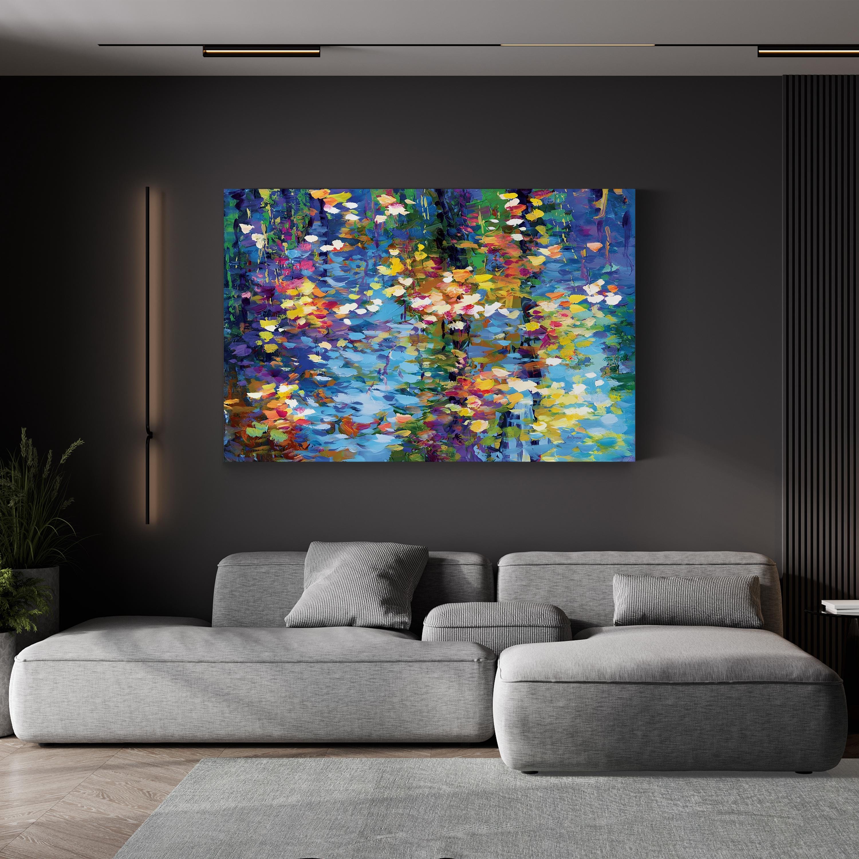 Modern living room with a gray sofa and colorful abstract painting on a dark wall.