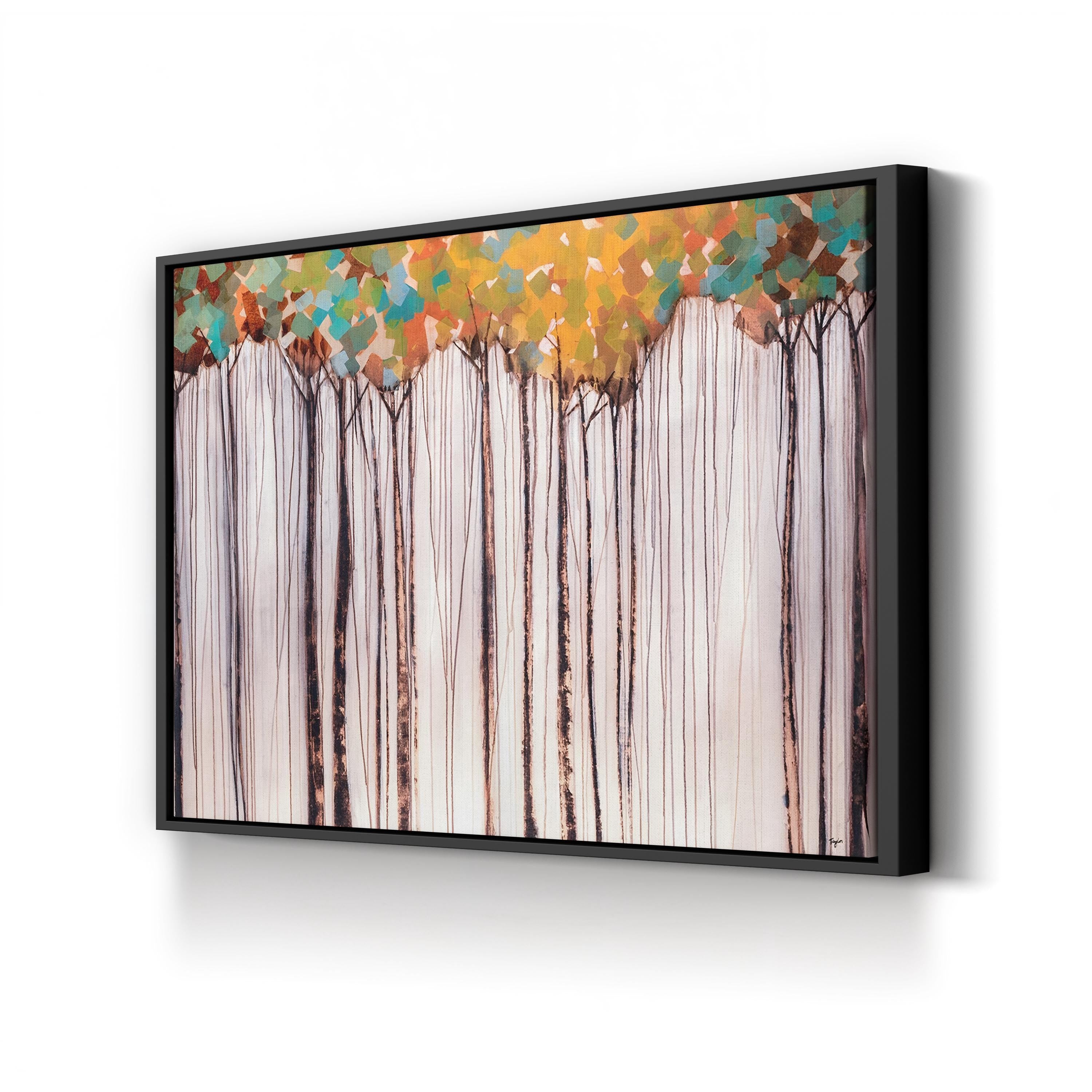 Framed artwork of trees with colorful foliage on a white wall