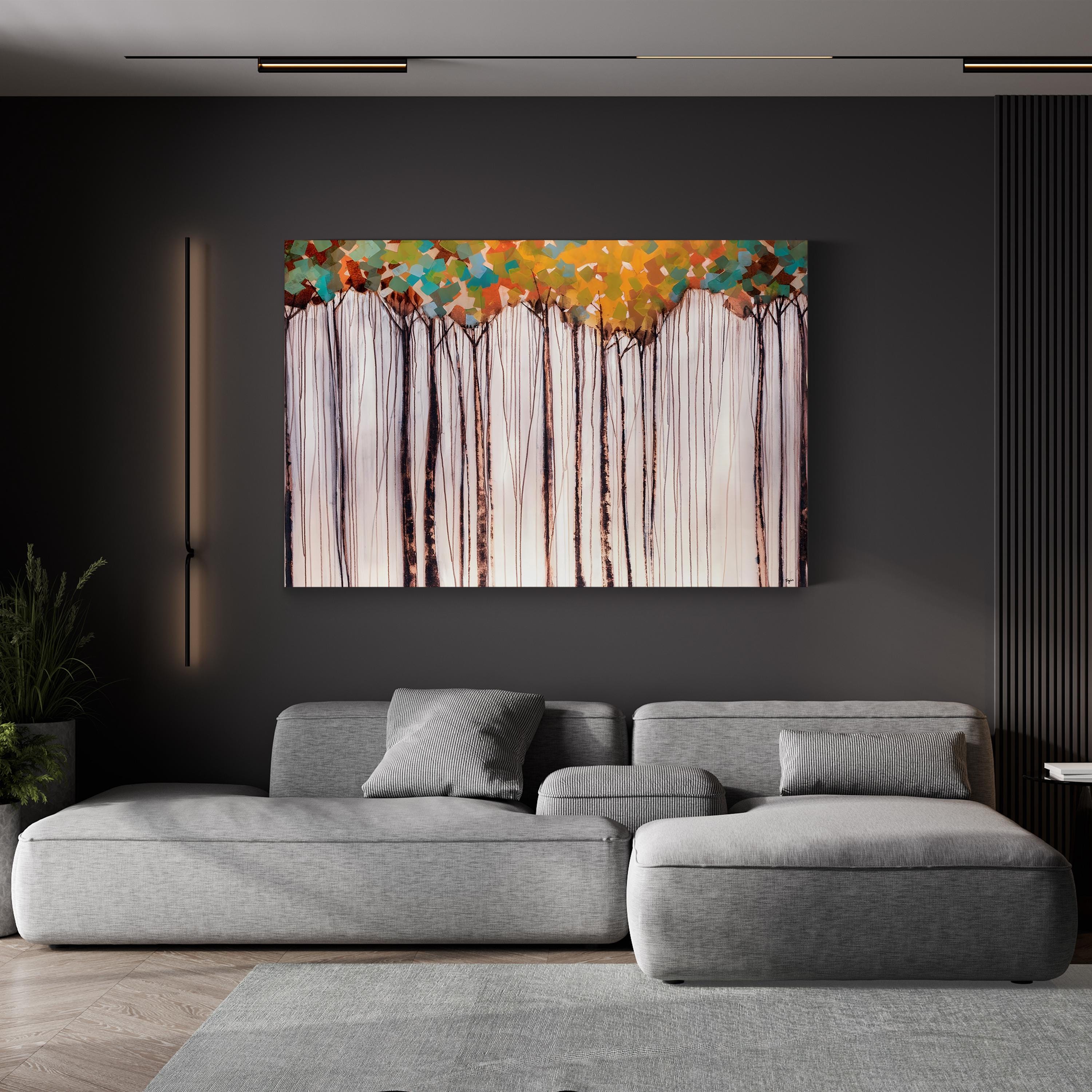 Modern living room with a gray sectional sofa and abstract wall art.