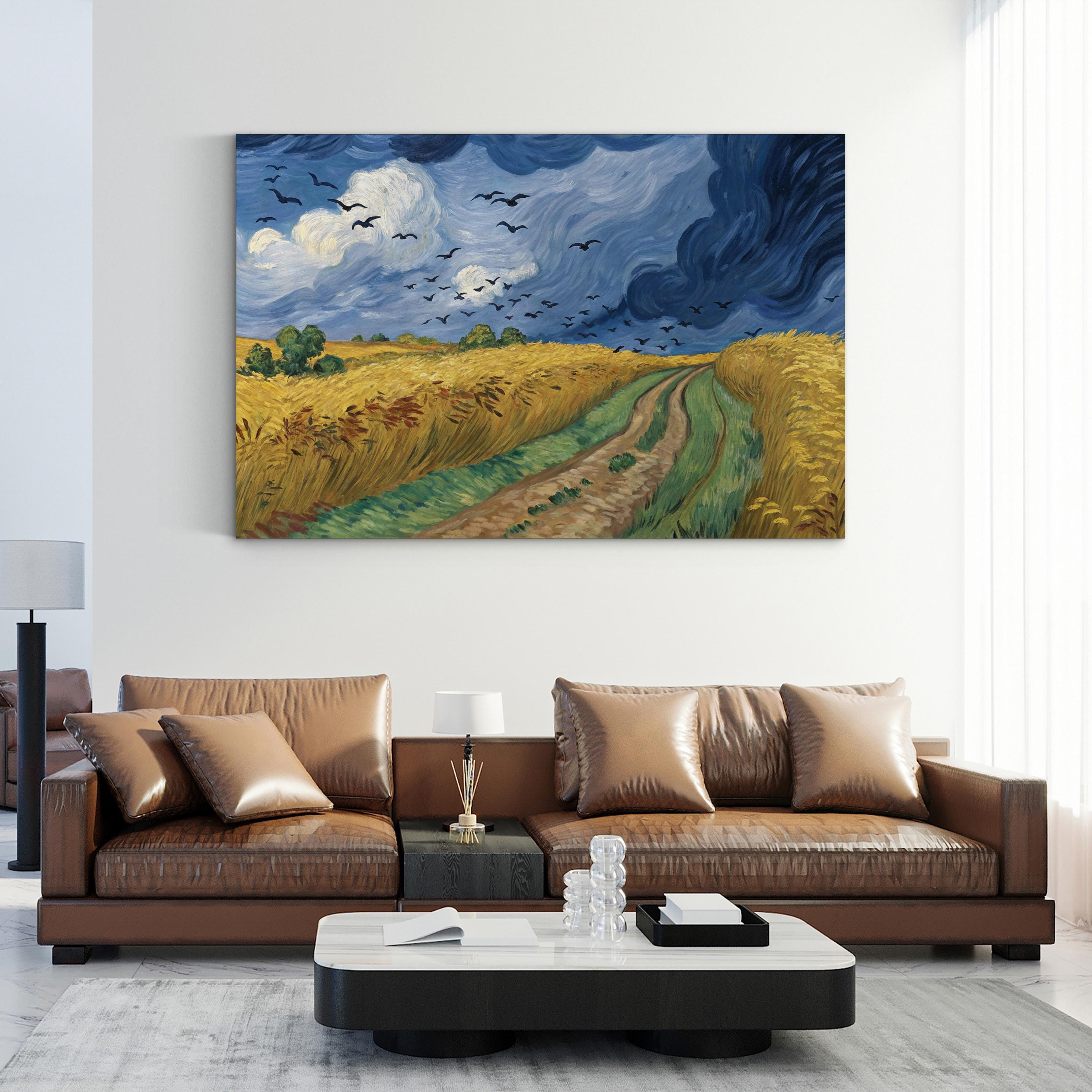 Wheatfield with Crows by Vincent van Gogh canvas print displayed above a gray sofa in a modern living room